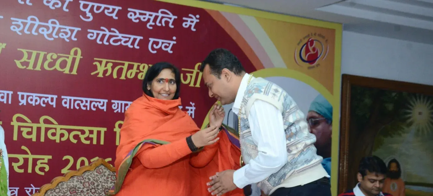 Dr. Anand Jaypuriya being felicitated during a community service programme